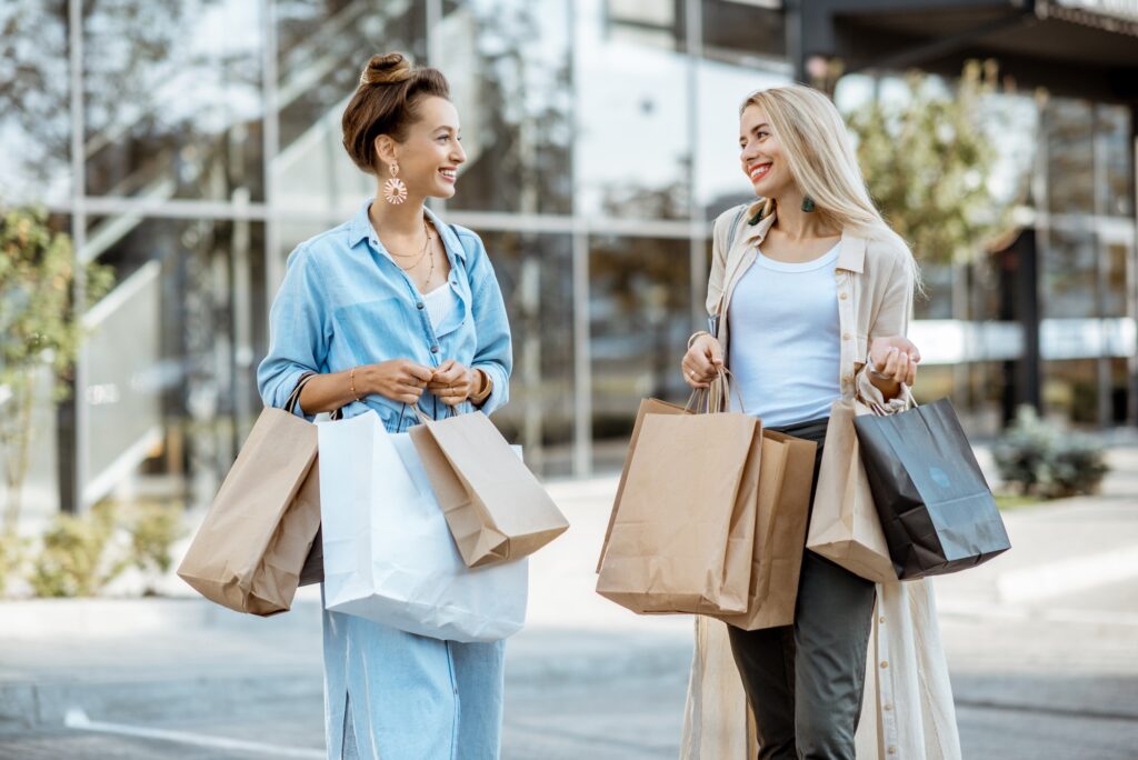 Women with shopping bags outdoors